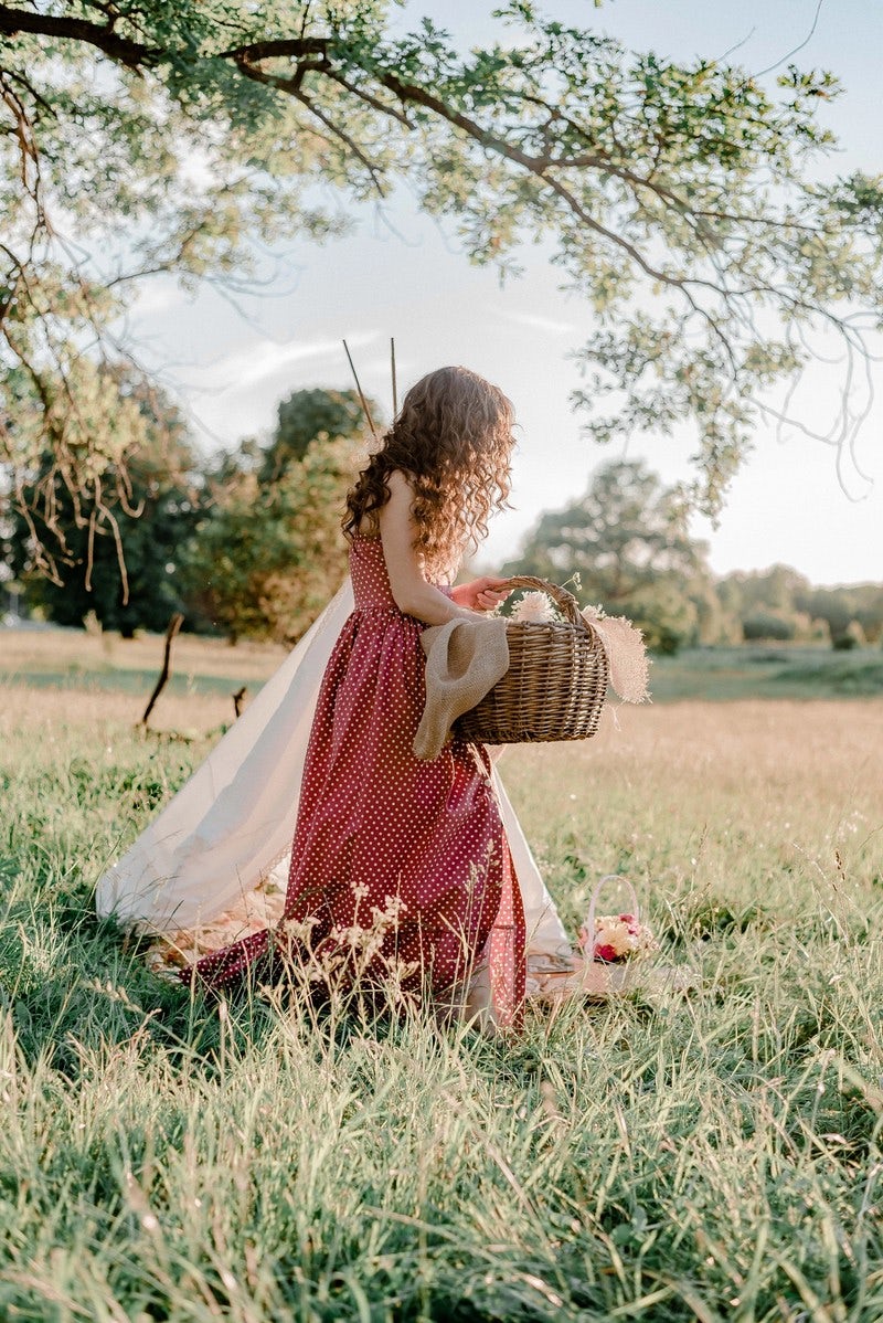 woman leaving with picnic basket
